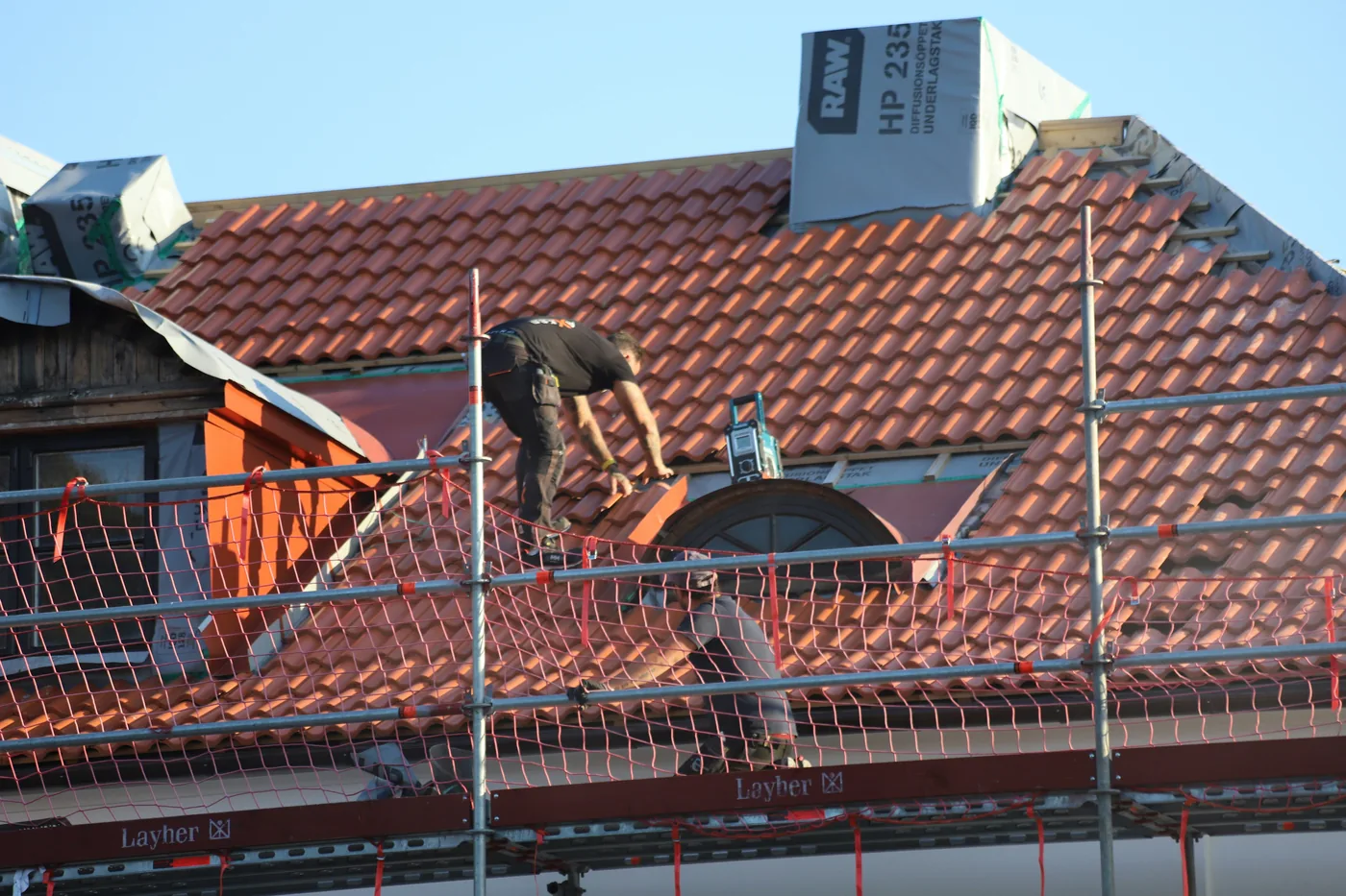 Roof work and protective treatment in progress
